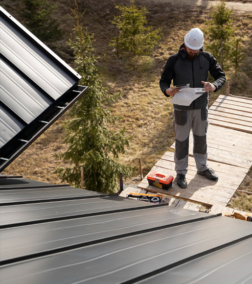 Project manager assessing roof